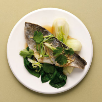 Steamed sea bass with pak choi, salad onion and ginger 