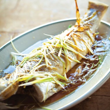 Steamed whole fish with ginger, scallions and soy