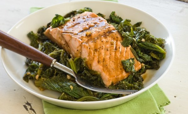 Steamed wild salmon with mustard greens, soy sauce, and ginger