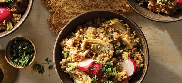 Steel-cut oat risotto with leeks, radishes, and artichokes 