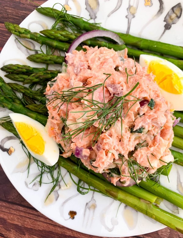 Steelhead trout salad with fennel and Meyer lemon on a bed of asparagus