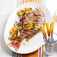 Stephanie Izard's juniper-grilled fish stuffed with fennel & onion
