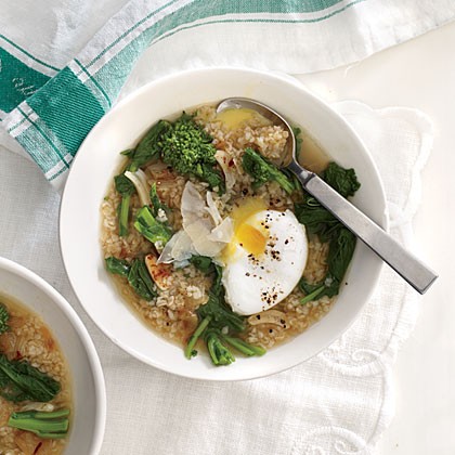 Stewed bulgur and broccoli rabe with poached eggs