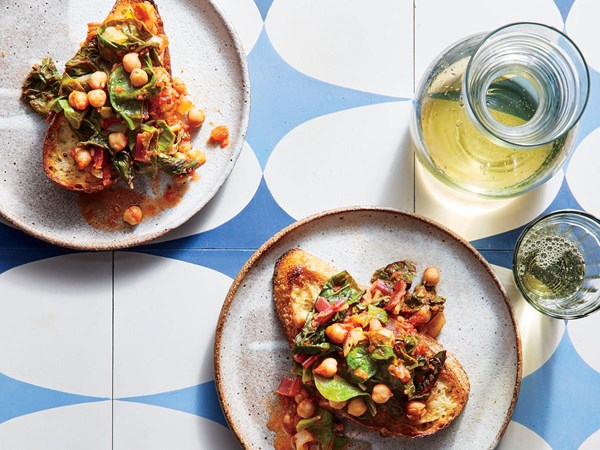 Stewed chickpeas and chard over garlic toast