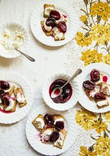 Stewed plums atop oatcakes w/ ricotta