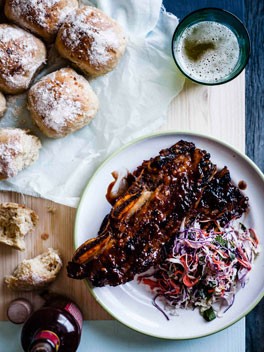 Sticky barbecue beef ribs with coleslaw and soft onion rolls