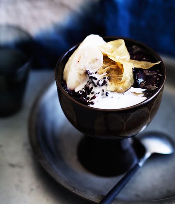 Sticky black rice with coconut cream, ginger syrup and banana