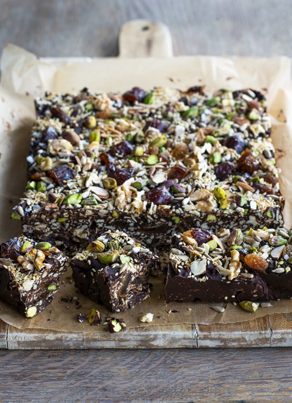 Sticky date, pistachio and seedy dark chocolate slice