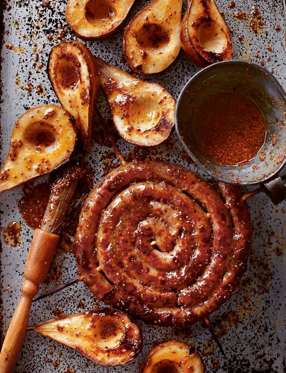 Sticky honey and mustard Catherine wheel sausage with pears, cobnuts and celeriac mash
