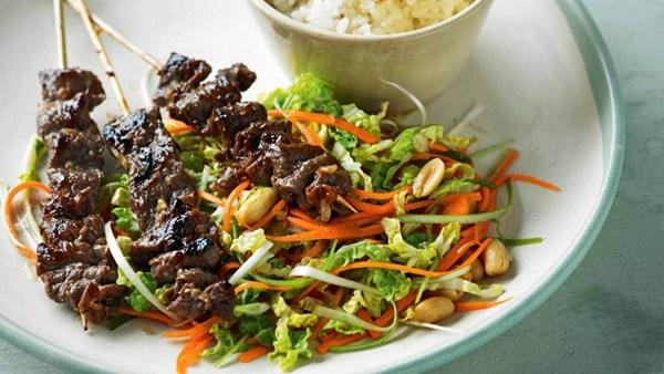 Sticky lemongrass beef skewers with Chinese cabbage and peanut slaw