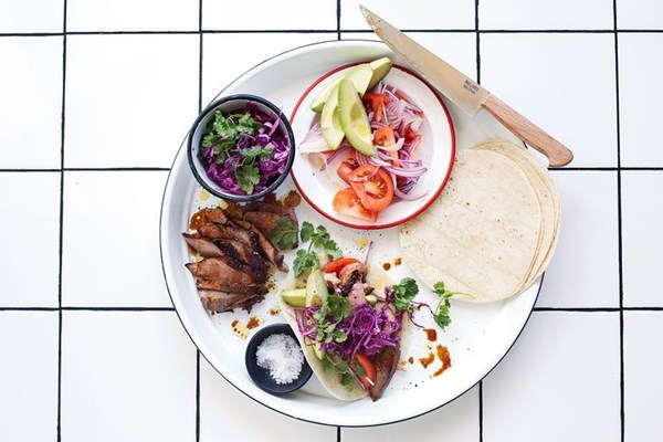 Sticky pork neck soft tacos with pickled cabbage