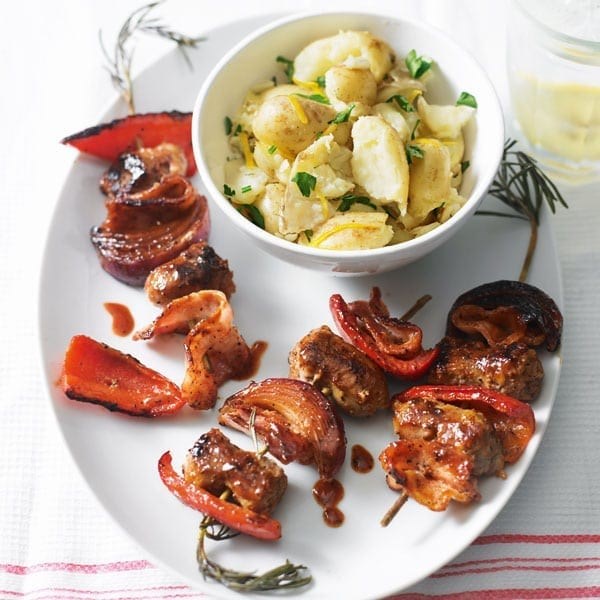 Sticky sausage kebabs with lemon potatoes