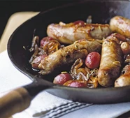 Sticky sausages with grapes
