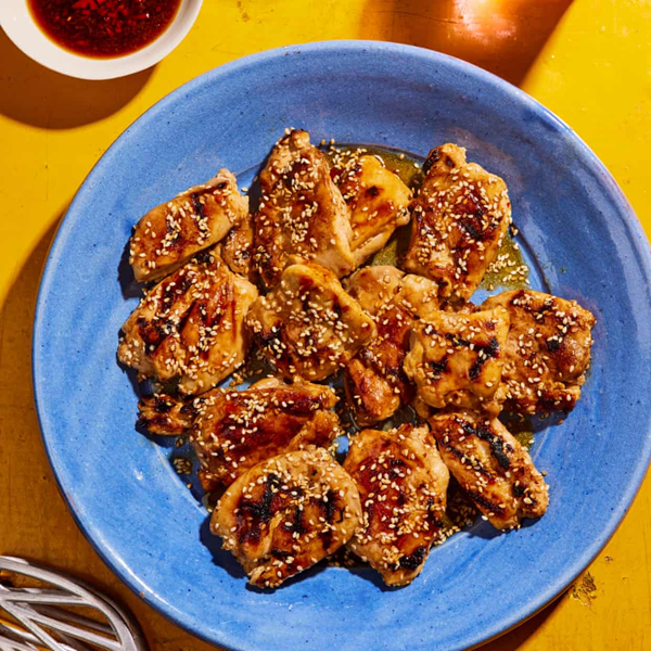 Sticky sesame and sweet chilli chicken, ginger soy dipping sauce