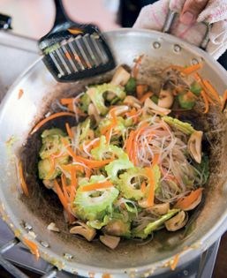 Stir-fried bitter melon with straw mushrooms (Khô qua xào nâm rom)