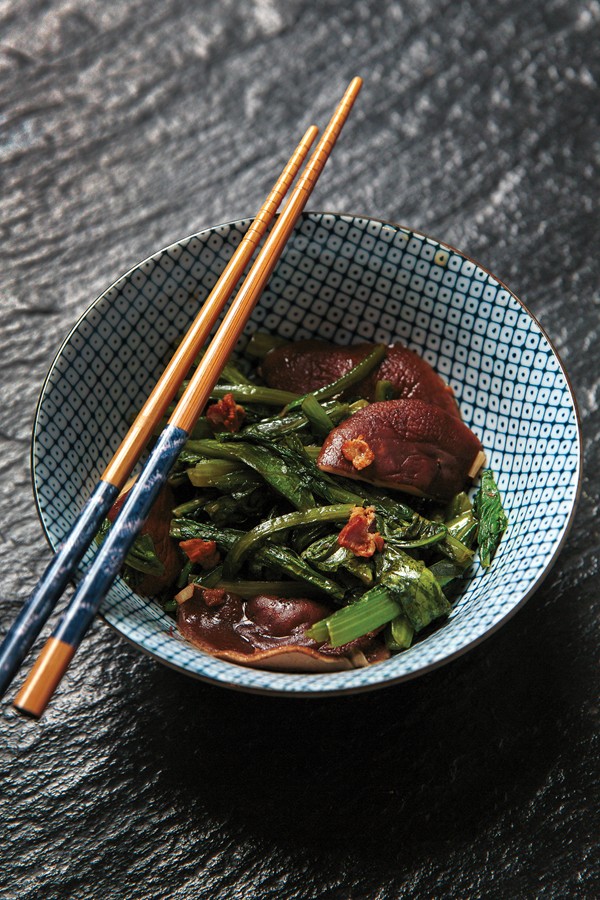 Stir-fried celtuce tops with mushrooms (Xianggu chao wosun ye)