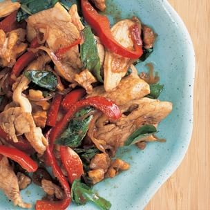 Stir-fried chicken with walnuts and basil