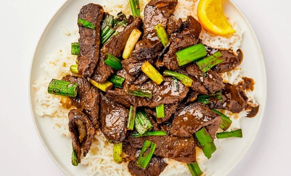 Stir-fried orange beef with scallions