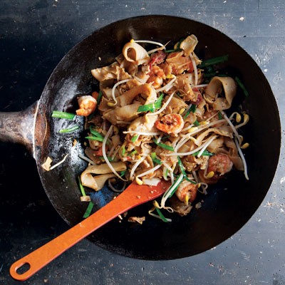 Stir-fried rice noodles (Char kuey teow)