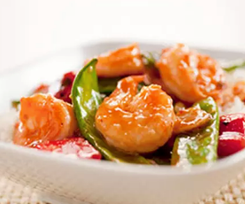 Stir-fried Sichuan-style shrimp with zucchini, red bell pepper, and peanuts