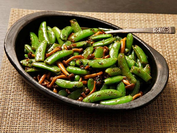 Stir-fried snap peas and mushrooms with fish sauce and basil