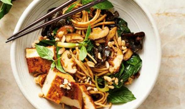Stir-fried udon, mustard greens, tofu and peanut sauce