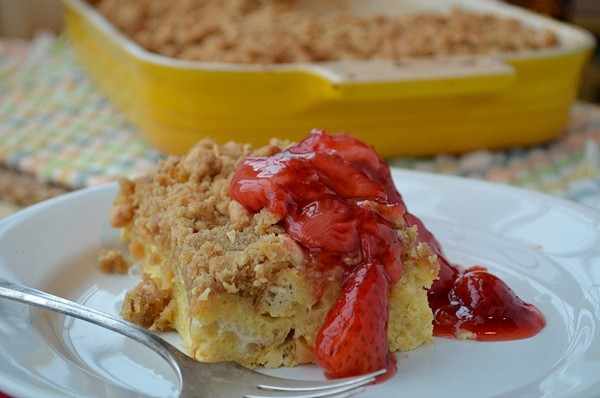 Strata with French toast flavorings and strawberry sauce
