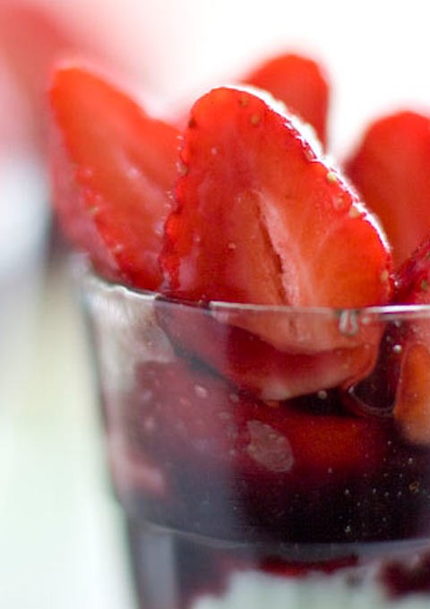 Strawberries in red wine syrup with rosewater cream