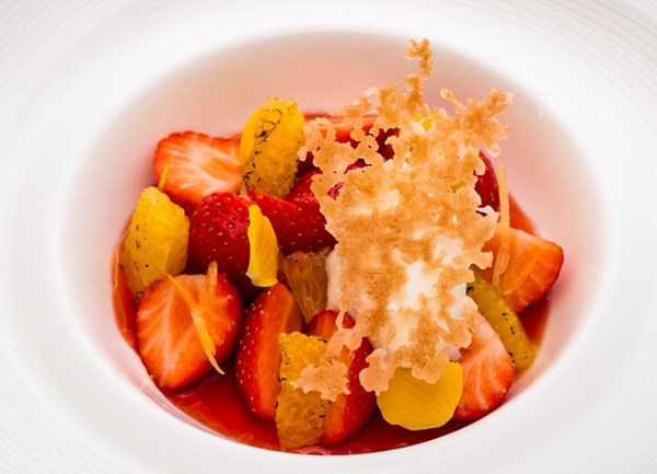 Strawberry and orange soup with citrus cream and puff pastry crisps