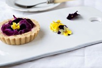 Strawberry and pansy tart