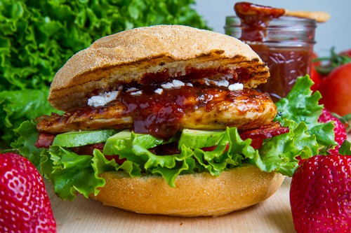 Strawberry BBQ chicken club sandwich with bacon, avocado and goat cheese