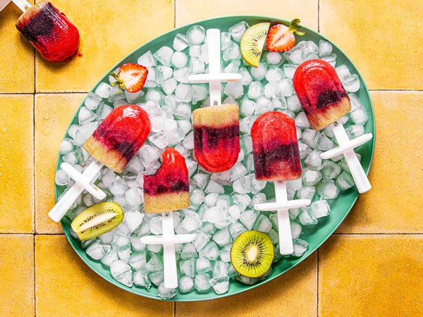 Strawberry, blackberry, and kiwi pan-African flag popsicles 