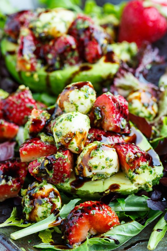 Strawberry Caprese stuffed avocados with pistachio pesto