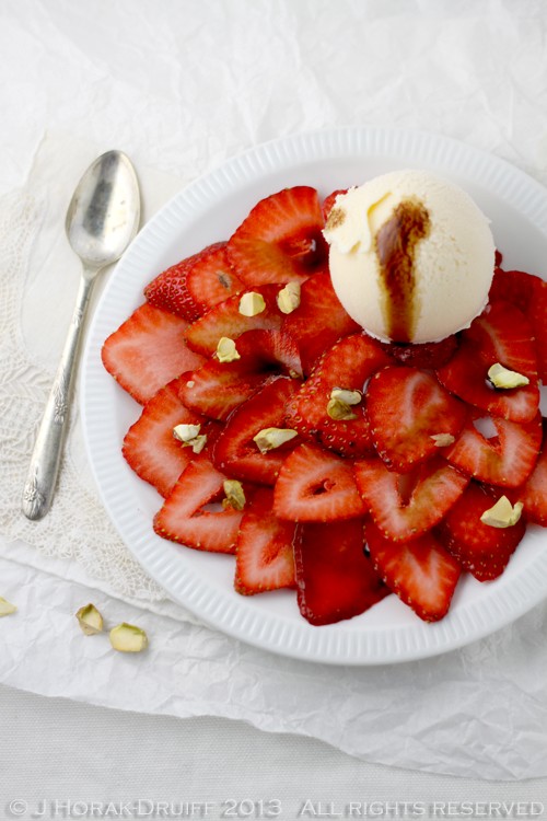 Strawberry carpaccio with smoked balsamic reduction and toasted pistachios