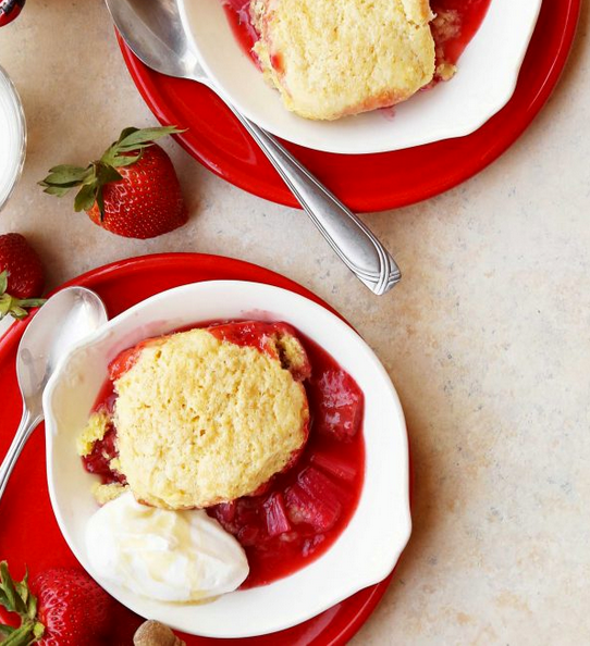 Strawberry rhubarb cobbler with cornmeal biscuits and honeyed cream