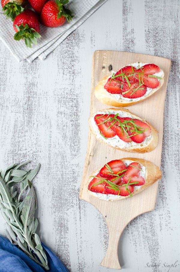 Strawberry ricotta crostini with basil, mint and sage