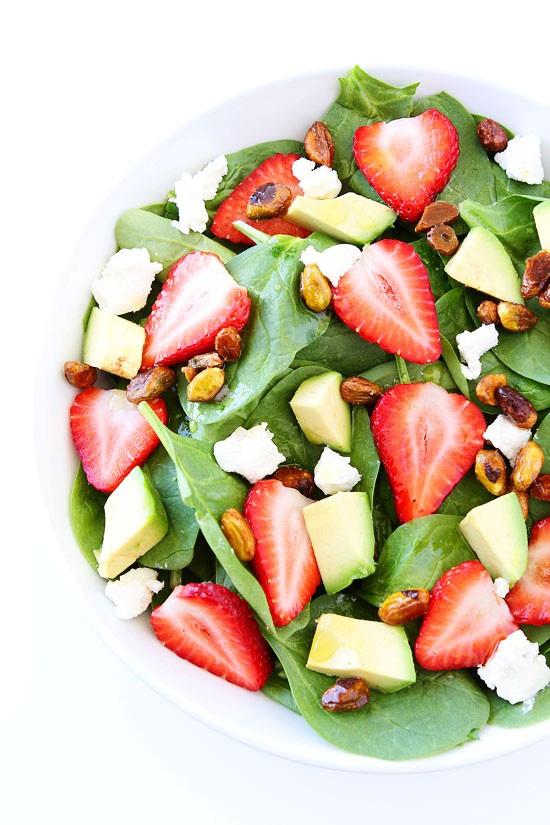 Strawberry spinach salad with avocado, goat cheese, and candied pistachios