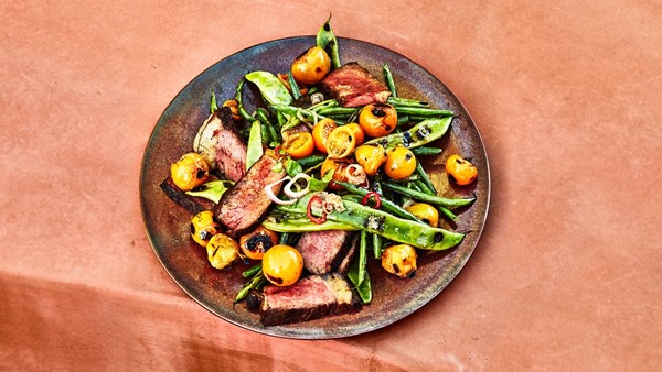 Strip steak with blistered beans and tomatoes