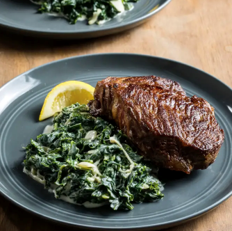 Strip steaks with creamed kale