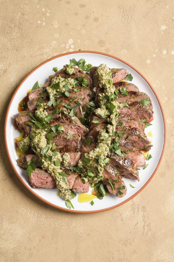 Strip steaks with walnut, parsley and caper sauce