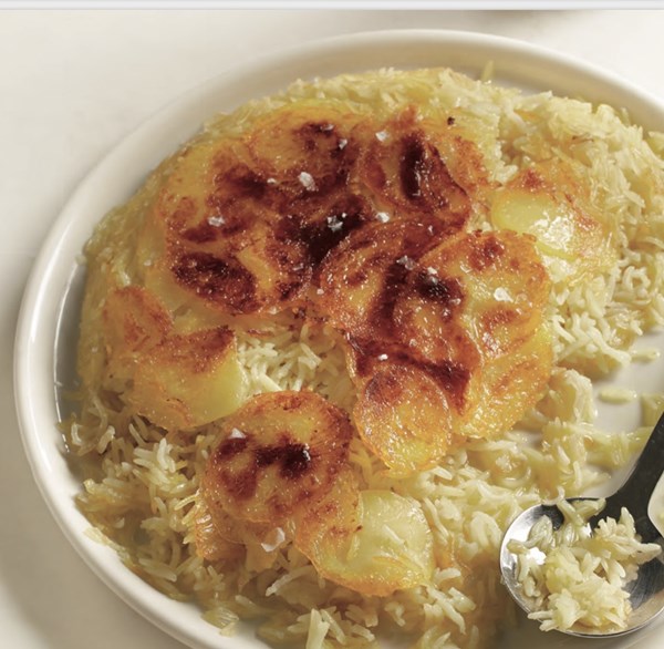 Stuck-pot rice with potato crust and lima beans