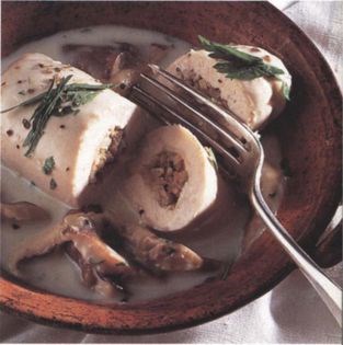 Stuffed and rolled chicken fillets with orange and mushroom sauce