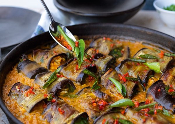 Stuffed aubergine in curry and coconut dal