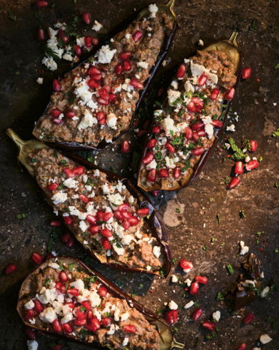 Stuffed aubergine with walnuts, pomegranate, and feta
