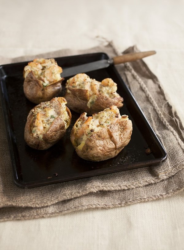 Stuffed baked potatoes with prawns and smoked fish