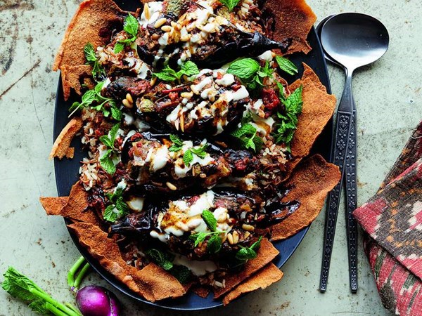 Stuffed eggplant over toasted pita (Makdous fetti)
