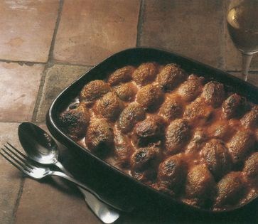 Stuffed onions baked in cream sauce