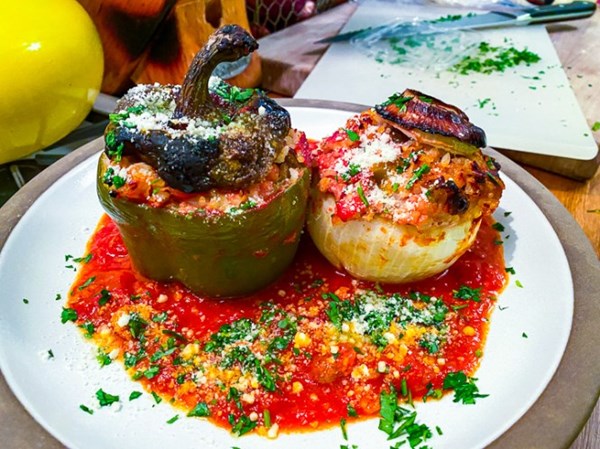 Stuffed onions, peppers, and tomatoes with sausage and rice