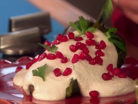 Stuffed poblano chiles in a creamy walnut sauce
