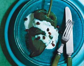 Stuffed poblano chiles with walnut sauce and pomegranate seeds (Chiles en nogada)